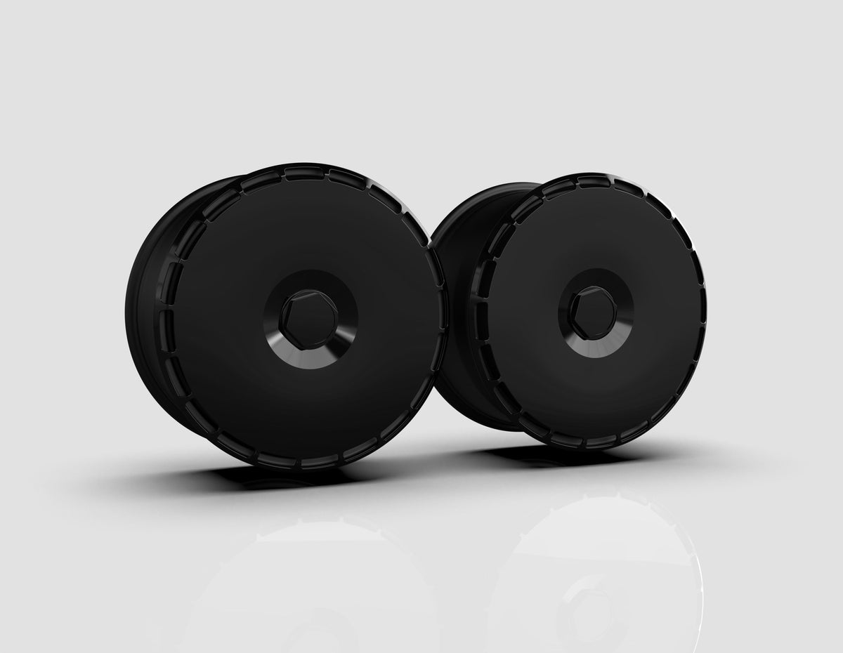 Pure Black aero wheel covers — studio render